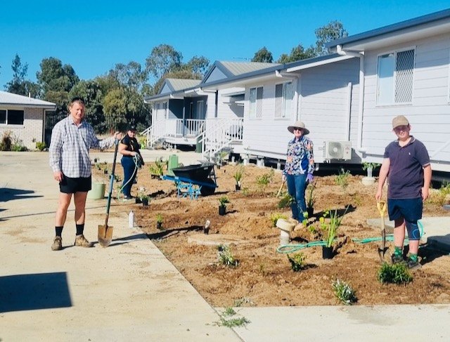 Rotary Club of Roma members planting gardens at a Pinaroo working bee, September 2023